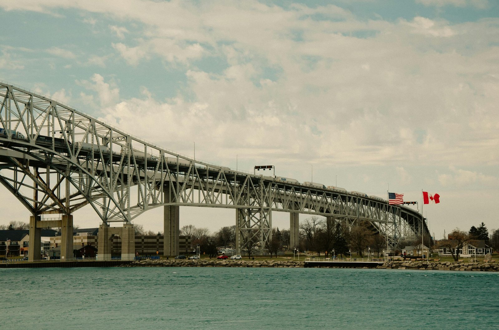 Iconic Blue Water Bridge spanning between the USA and Canada over clear waters.